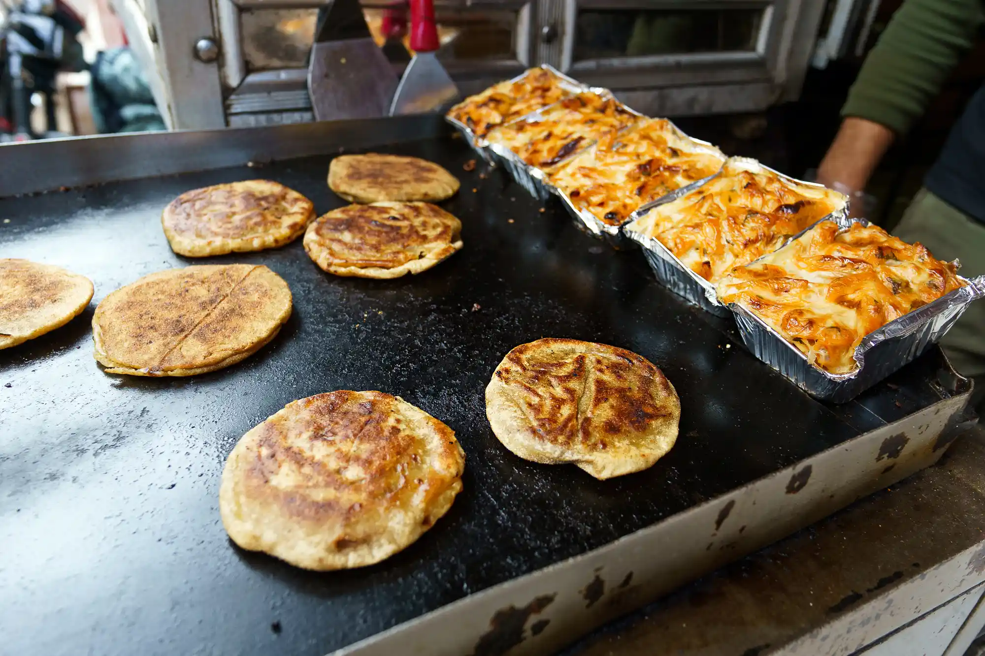 Hawawshi and Macarona Bechamel street food in Luxor.