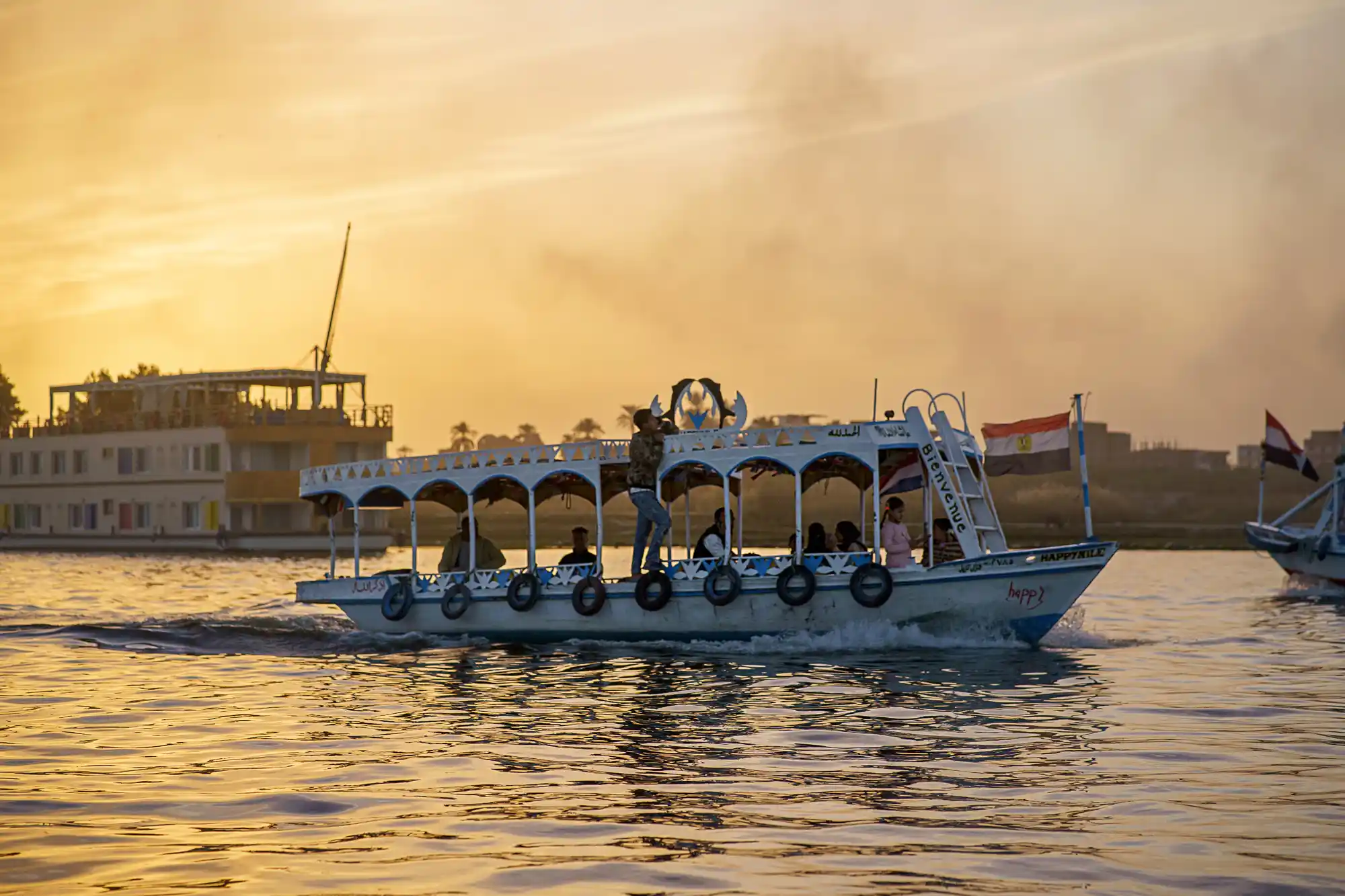 Smoke and a boat on the nile