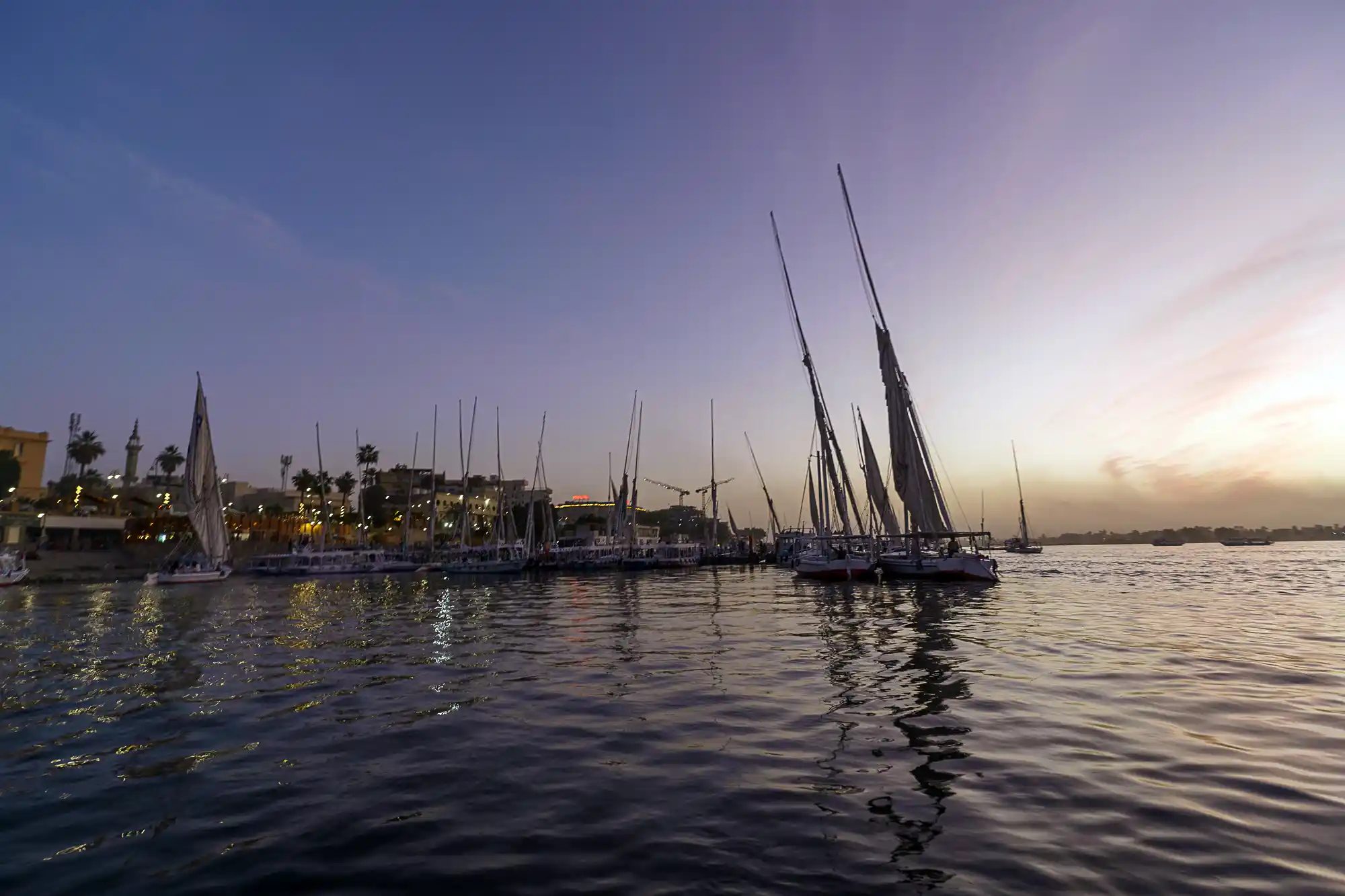 Boats gathered on the Nile at dusk