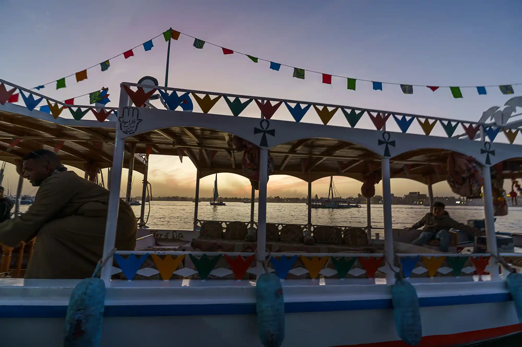 Sailing past Luxor at sunset