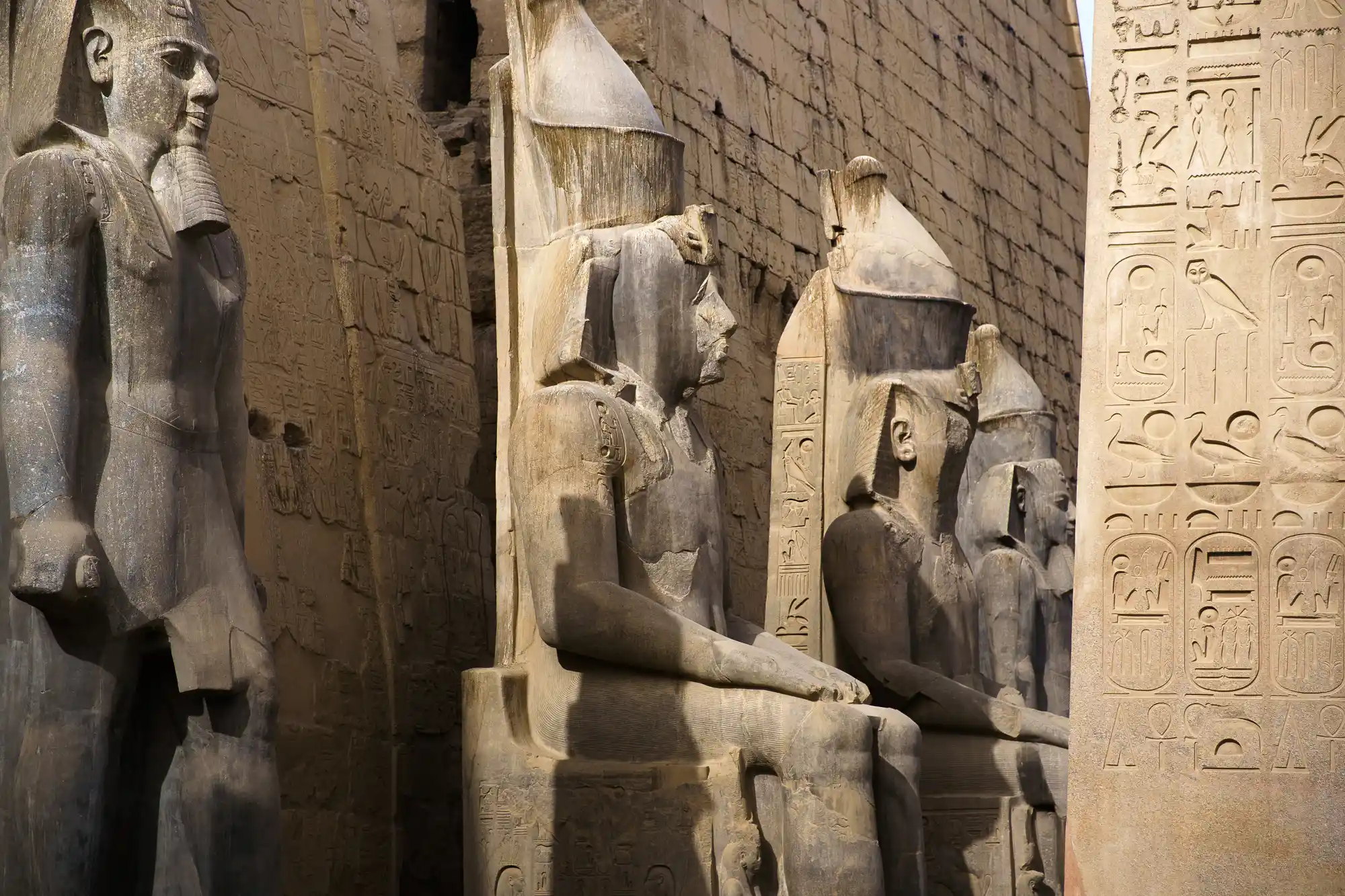 Pharaoh statues at the gate of the Luxor Temple.