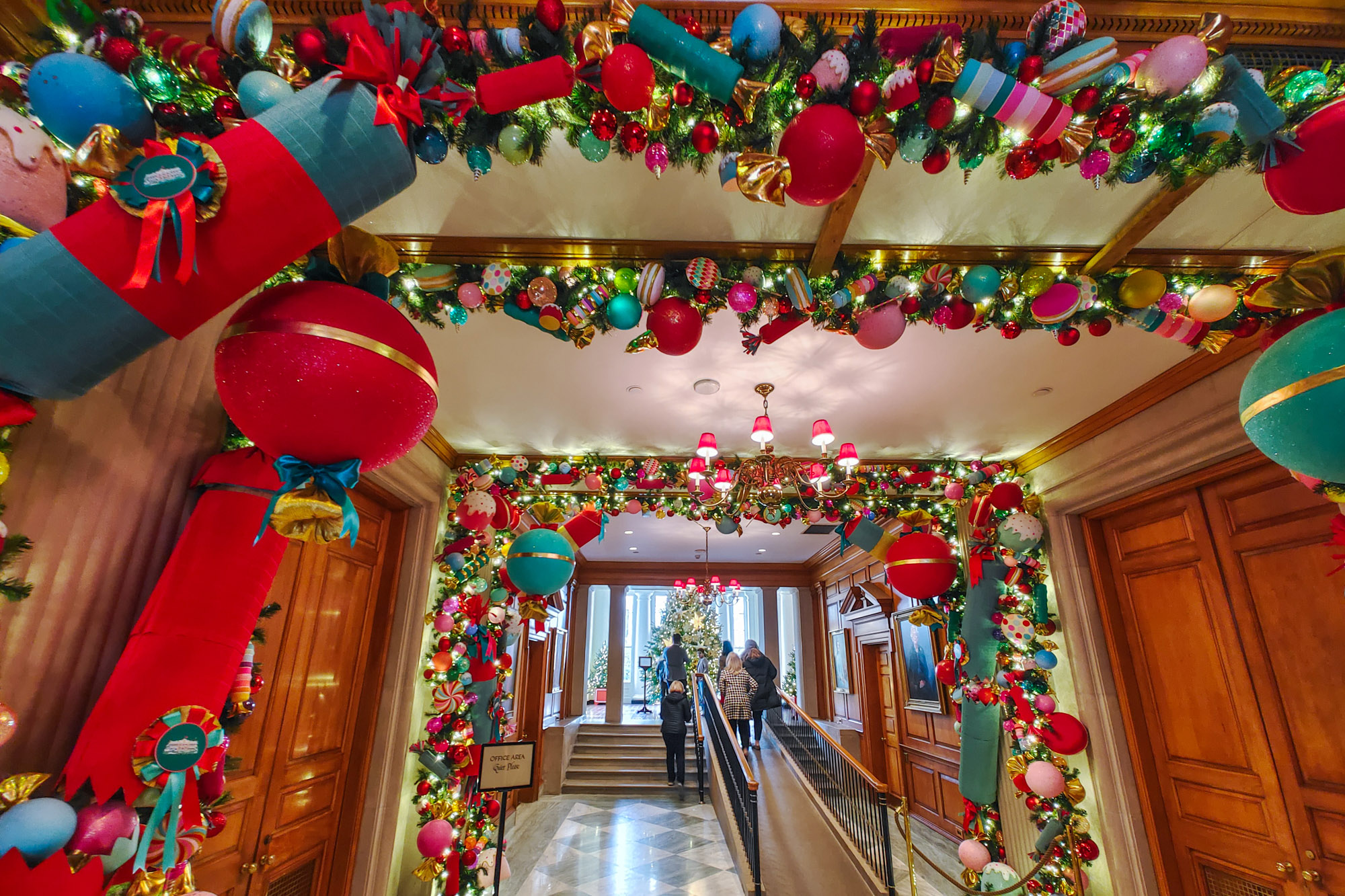 Long hallway at the White House decorated for Christmas