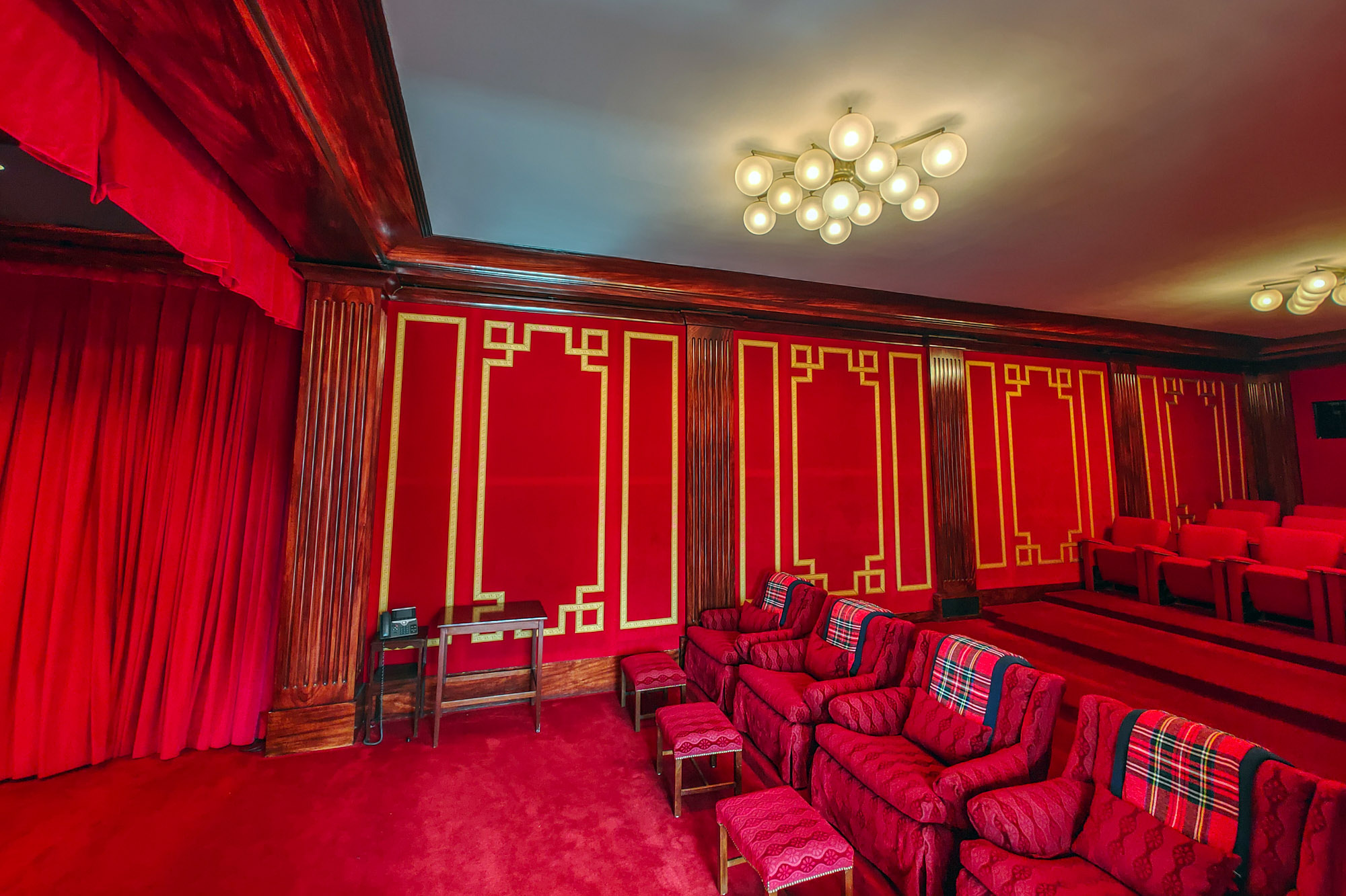 White House theaters inside with red comfy chairs