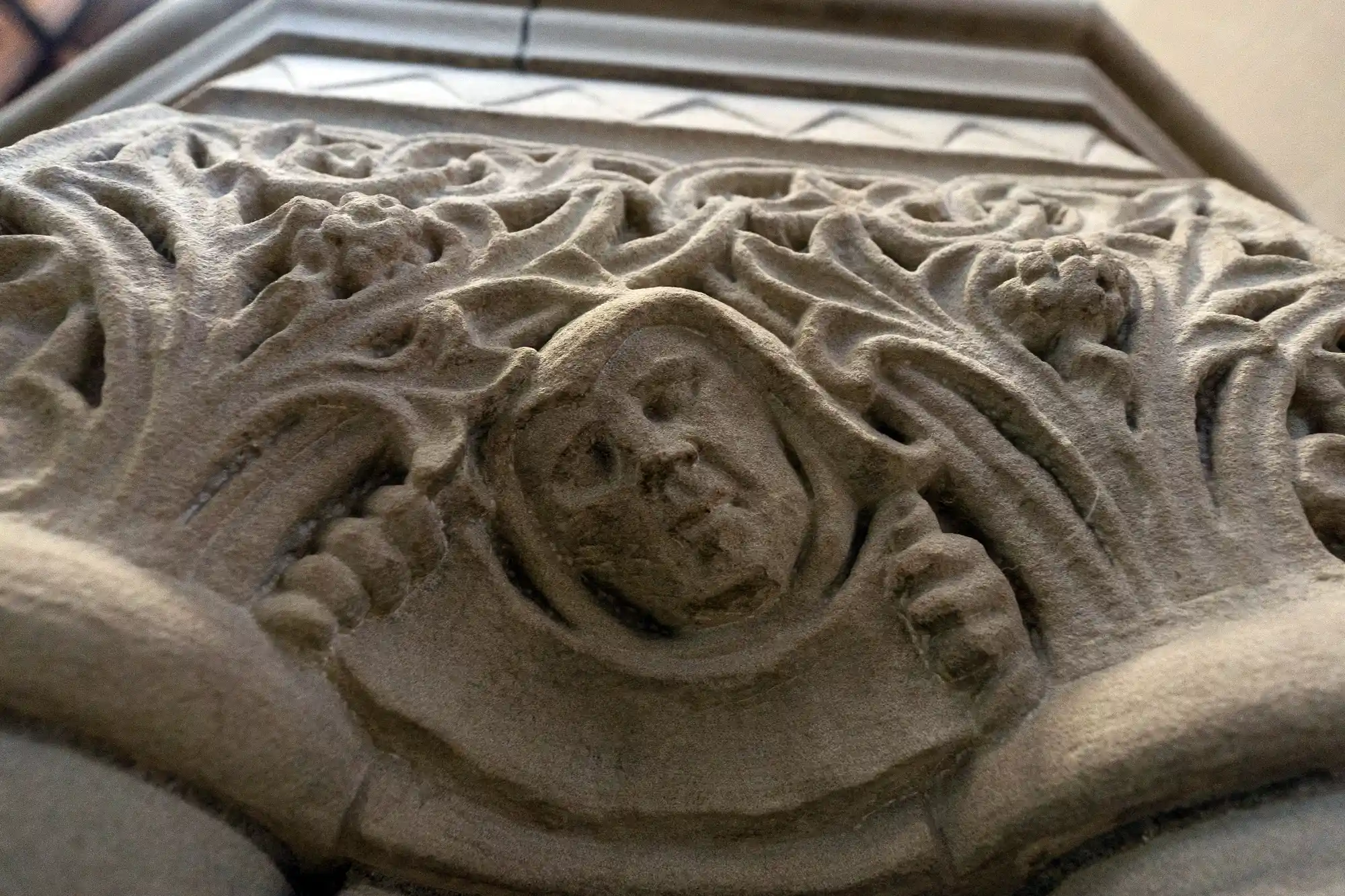 Stone carvings of a face for a fireplace