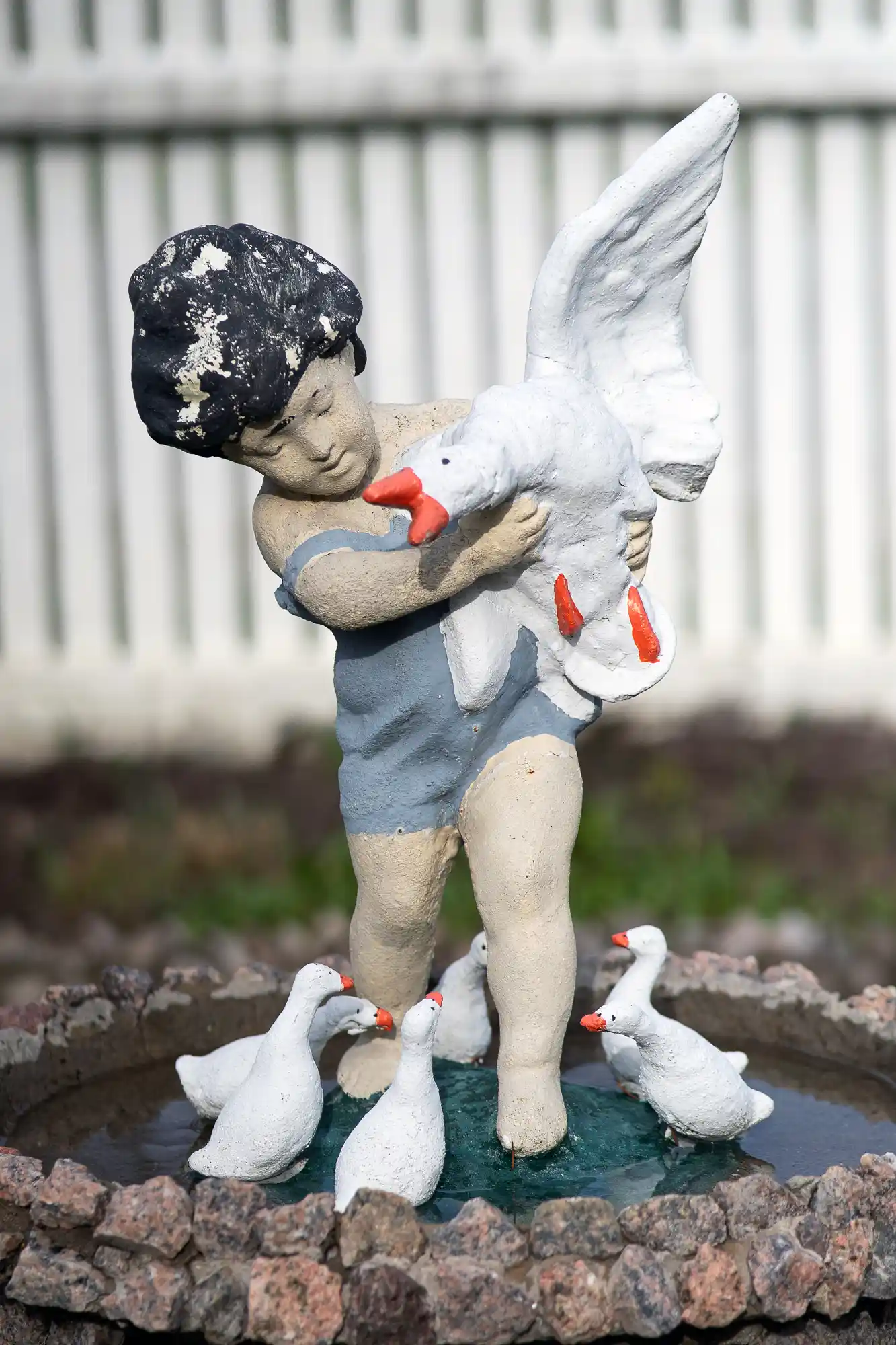 Child holding a goose in Springfield, Ohio