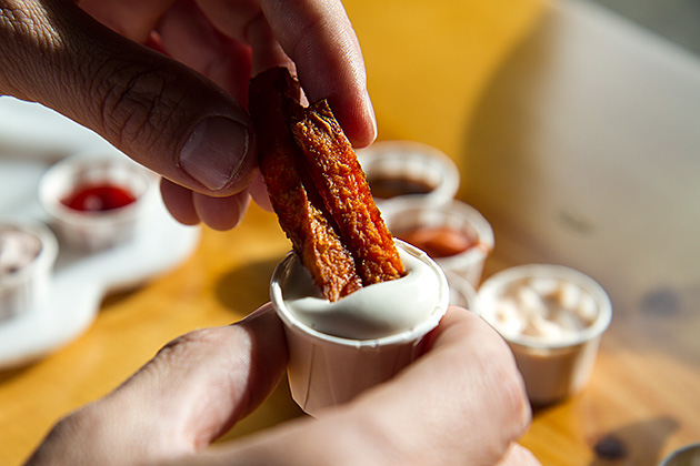 The Boise Fry Company 11 Dipping fries into french fries sauce