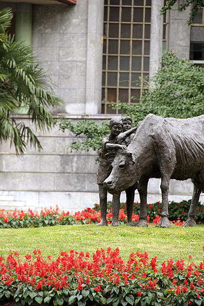Statue of petting cow