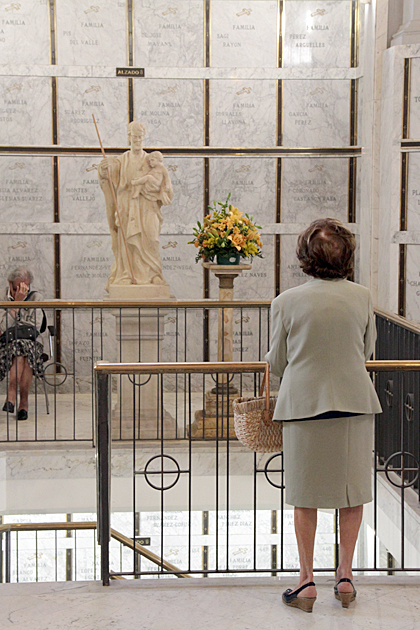 Grieving woman at cemetery