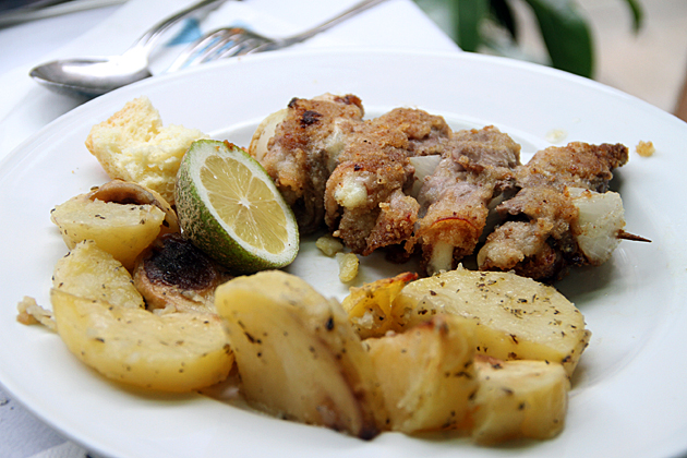 Meat skewers in Palermo with a a lemon