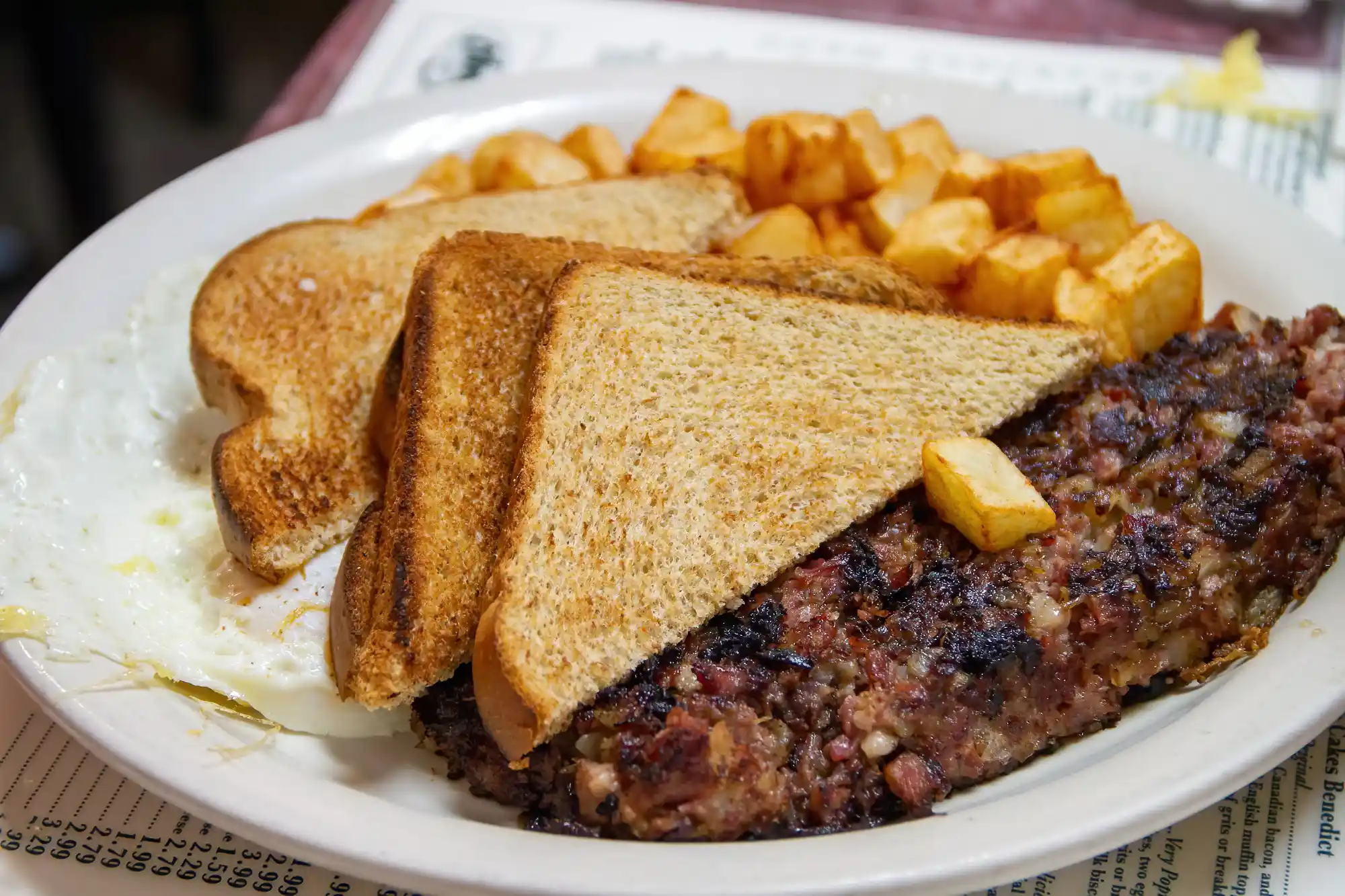 Breakfast with toast, eggs and potatoes