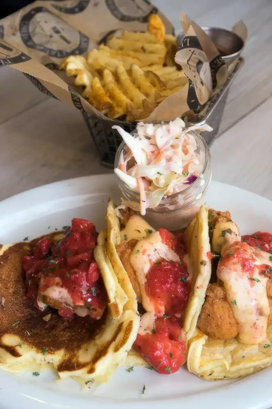 Pancakes with fried chicken with strawberry sauce at Treylor Park in Savannah