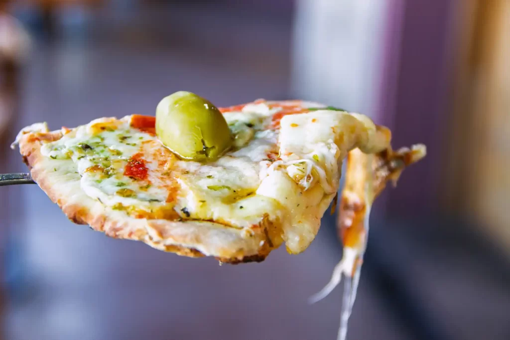 Bakano - Our Pizza Addiction Threatens to Destroy Us 1 Bakano Pizza in Buenos Aires with olive on top